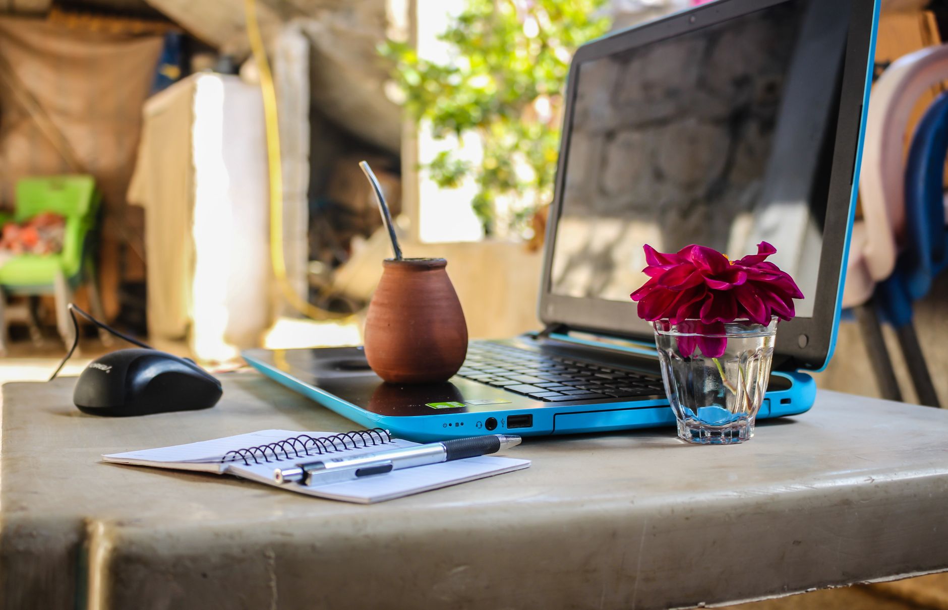 A person working on a laptop at home, illustrating a flexible side hustle.