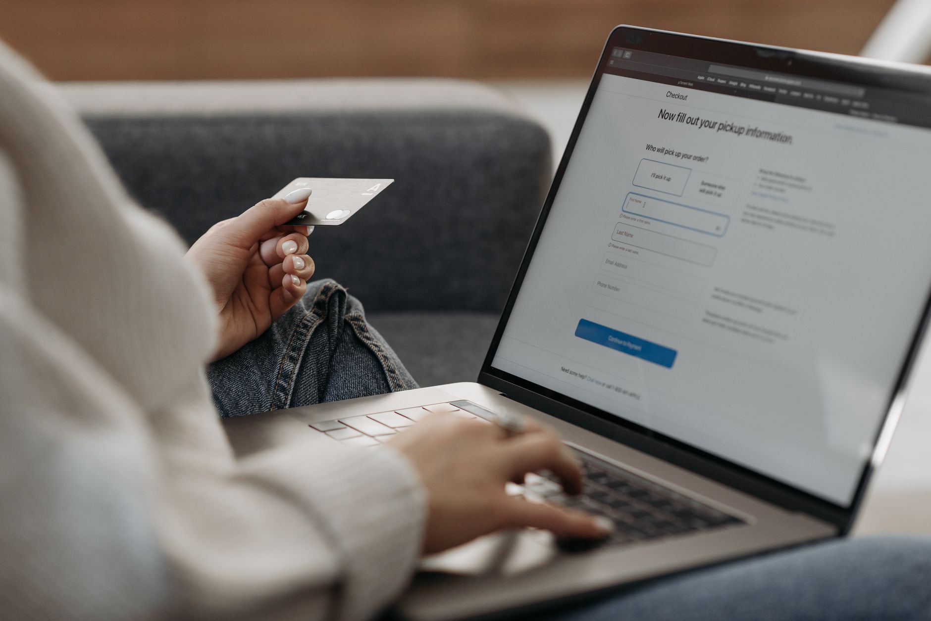 A person reviewing their free weekly credit report on a laptop screen via the official federal portal