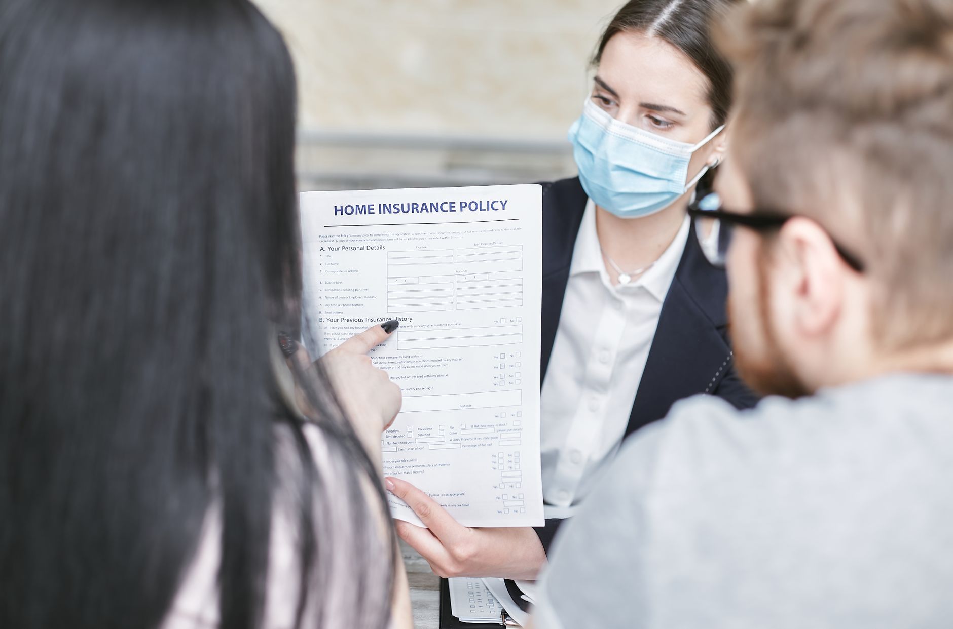 A person reviewing health insurance benefits paperwork to check HSA eligibility