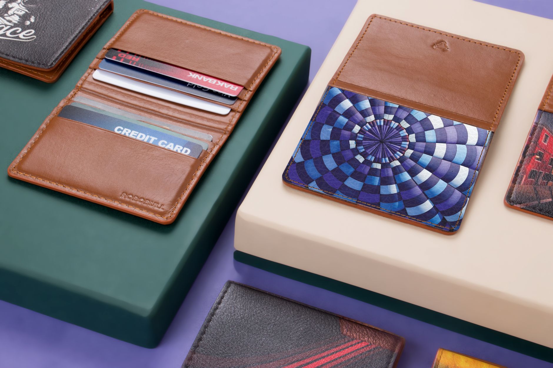 A minimalist wallet fanned open showing three credit cards labeled for different spending categories