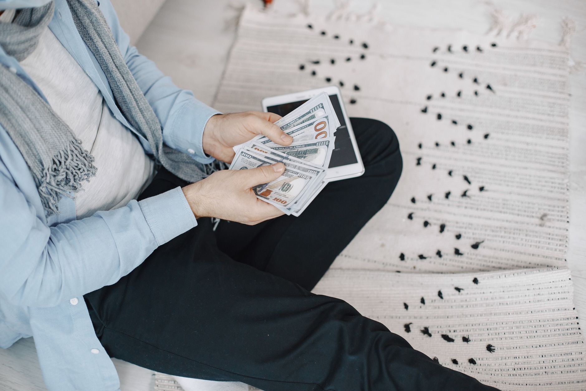 Budgeting on a tablet to manage salary increases and avoid lifestyle inflation
