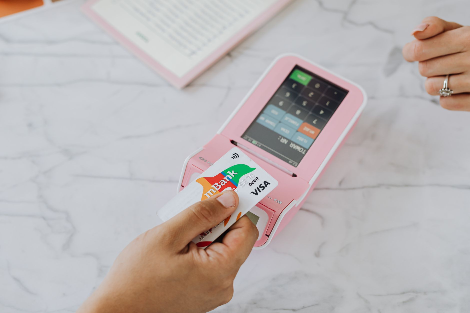 A person making a payment on their laptop to clear high-interest credit card debt