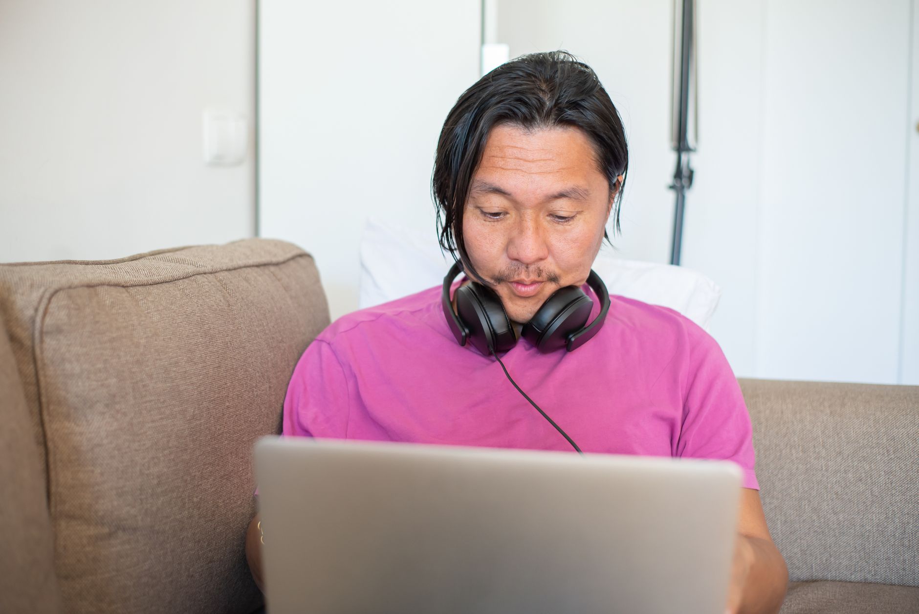 A concerned professional reviewing their employee benefits portal on a laptop screen