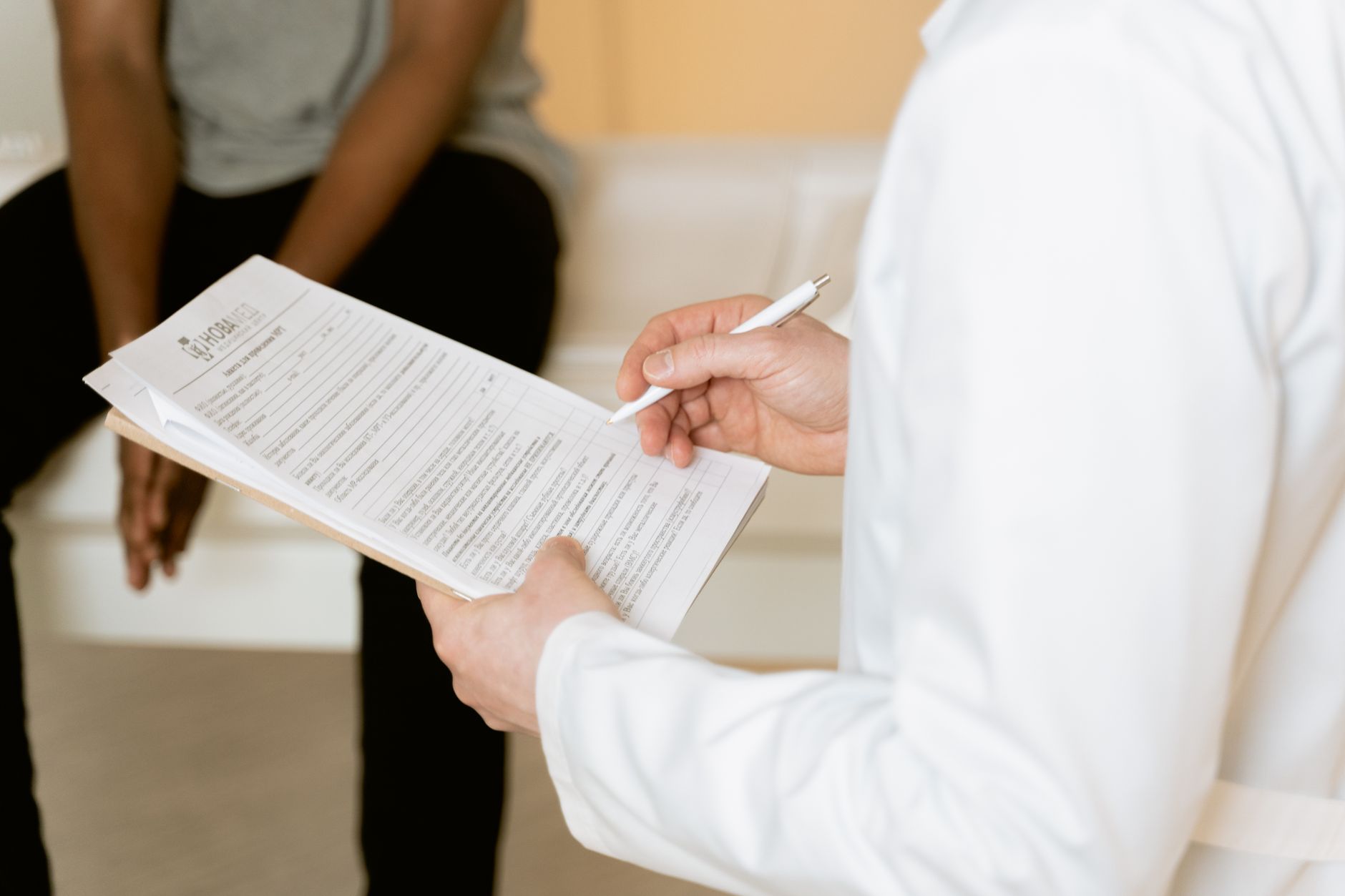 A doctor discussing treatment options with a patient in a bright medical office