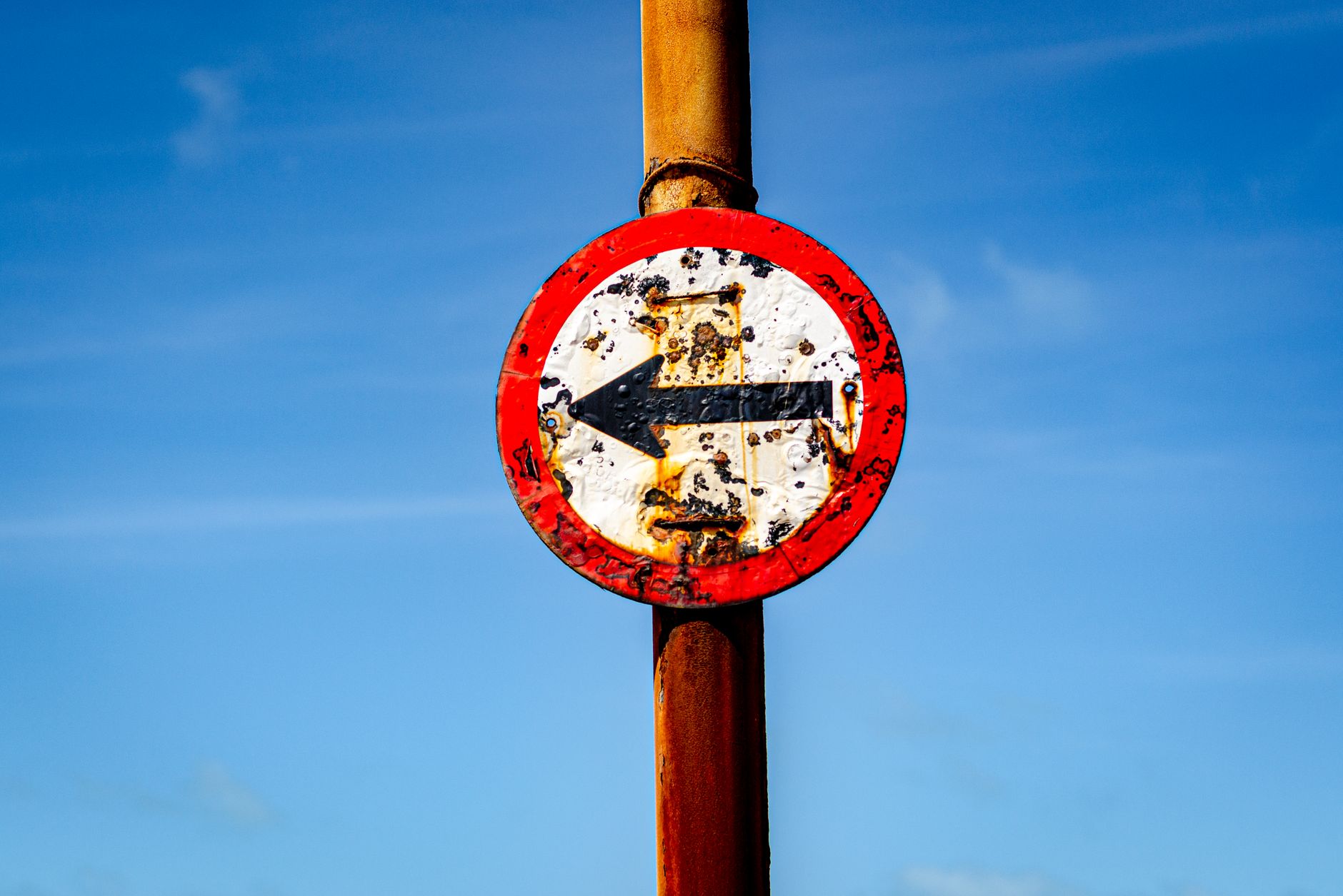 A shield icon with a graph line trending downward and a dollar sign, symbolizing the risks and tax considerations associated with REIT investing