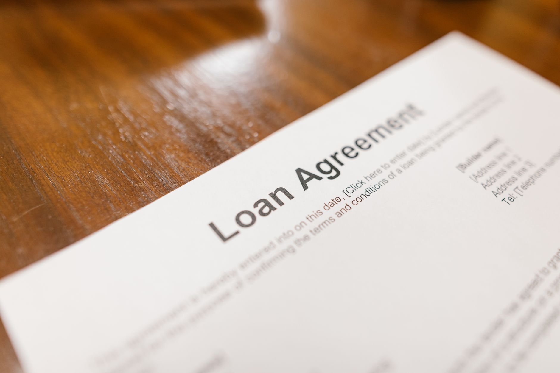 A close‑up of a private student loan agreement highlighting interest rate terms.