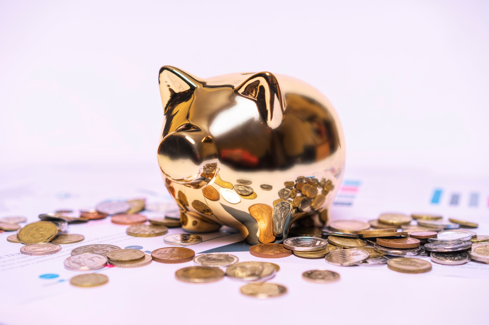 A visual of a piggy bank splitting into two halves labeled credit union and bank, with interest arrows showing potential earnings
